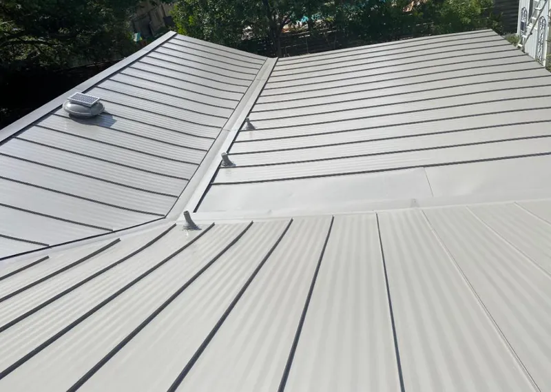 Solar attic fan installed on a metal roof for Roof Ventilation in South Bradenton